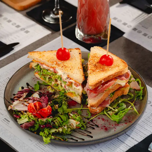 Club sandwich breakfast in Theatrum, Toasted bread, cheese, mayonnaise, tomato, salad
