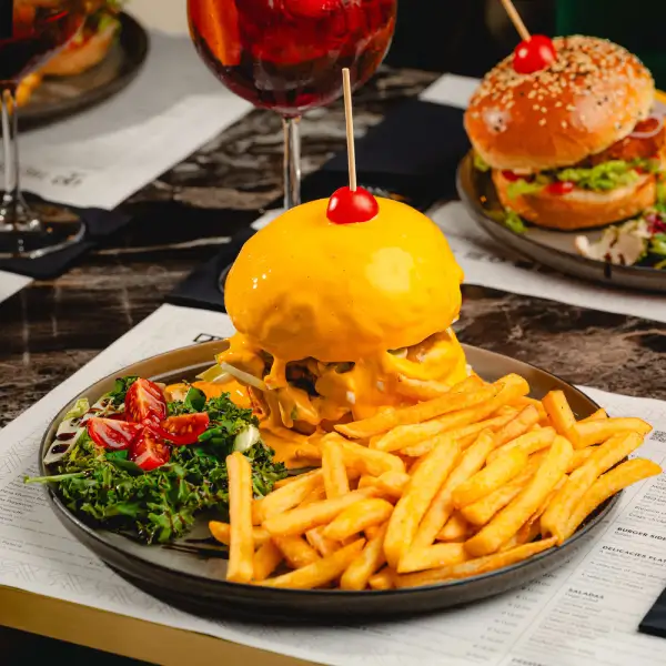 Premium cheeseburger and fries - Cheeseburger bun covered with cheese